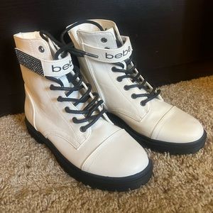 Brand new. Never worn. Size 6 Bebe combat style boot.